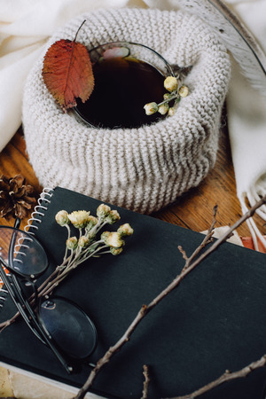 Flat lay. Notebooks and glasses on the wooden backgroundの写真素材