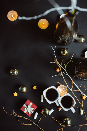 Winter composition. Two cups of coffee on a dark background. Flat layの写真素材