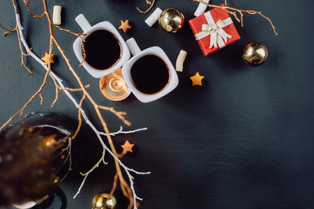 Winter composition. Two cups of coffee on a dark background. Flat layの写真素材