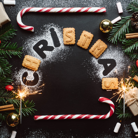 Christmas background with festive decoration, and firework on dark background. Winter flat layの写真素材