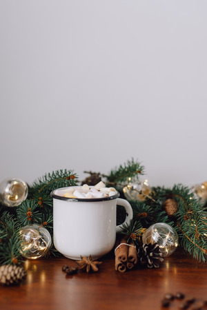 Chocolate or cocoa with marshmallow and garland on a wooden background.の写真素材