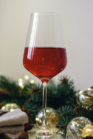 Table with Christmas decorations and green spruce branchesの写真素材