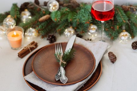 Table with Christmas decorations and green spruce branchesの写真素材