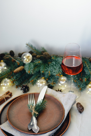 Table with Christmas decorations and green spruce branchesの写真素材