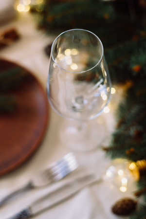 Table with Christmas decorations and green spruce branchesの写真素材