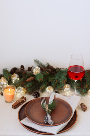 Table with Christmas decorations and green spruce branchesの写真素材