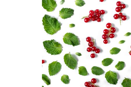 Fruit pattern made of fresh berries, green leaves and frame on white background. Concept of healthy food. Flat lay, top view, copy spaceの写真素材
