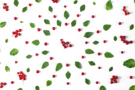 Fruit pattern made of fresh berries and green leaves on white background. Concept of healthy food....