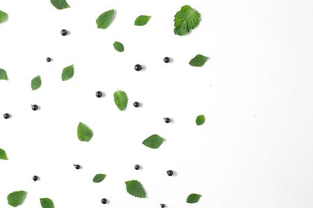 Fruit pattern made of fresh berries, green leaves and frame on white background. Concept of healthy...