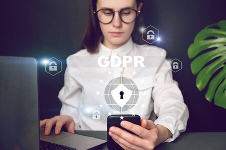 Cyber internet security concept. GDPR and cybersecurity. Close up front view young woman holding...