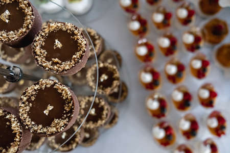 Close up of sweet table for wedding ceremony or birthday. Candy bar with a lot of different candies...