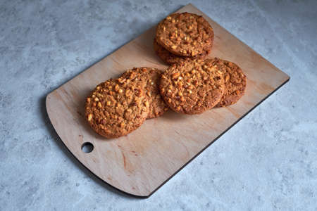 fresh homemade oatmeal cookies on a wooden board