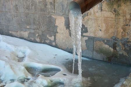 Frozen melt water in a drain pipe
