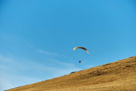 paragliding against the blue skyの写真素材