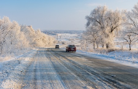 Dnepropetrovsk oblast, Ukraine - January 22, 2016: Private transport moving on a country slippery road at winter seasonのeditorial素材