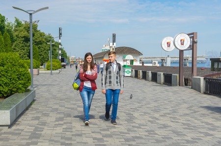 DNEPR, UKRAINE - MAY 21, 2016:Young couple walking on the Dnepr river embankment at May 21, 2016 in Dnepr, Ukraineのeditorial素材