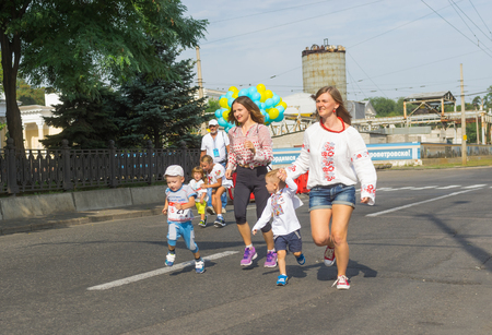 Dnepr, Ukraine - August 24, 2016: Kids running in Vyshyvanka Run during Independence Day local activity in Dnepr, Ukraine at August 24, 2016のeditorial素材