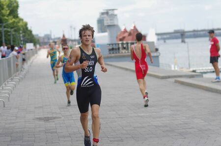 DNIPRO, UKRAINE - JUNE 08, 2019: Vidensek David running on an city embankment during of theのeditorial素材