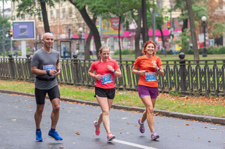 DNIPRO, UKRAINE - SEPTEMBER 16, 2018: Group of happy and smiling participants running during 21 km distance of ATB Dnipro Marathon raceのeditorial素材