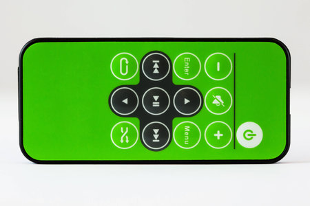 Green remote control on white backgroundの写真素材