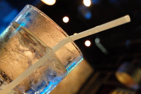 Glass of ice water in a restaurantの写真素材