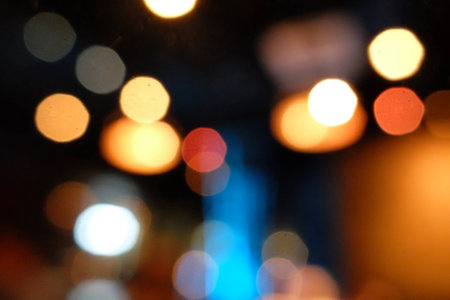 Bokeh of light in a bar at nightの写真素材