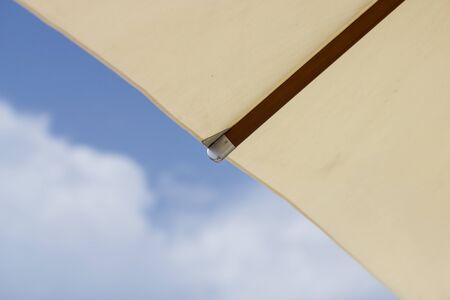 White beach parasol. Close up white umbrella and umbrella ribs. Vacation concept.の写真素材