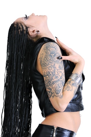 young tattooed stylish woman with dreadlocks, isolated on whiteの写真素材