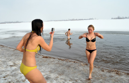 CHERKASY, UKRAINE - JANUARY 19: Unidentified people swimming in ice cold water during Epiphany (Holy Baptism) in the Orthodox tradition, January 19 , 2012 in Cherkasy, Ukraineのeditorial素材