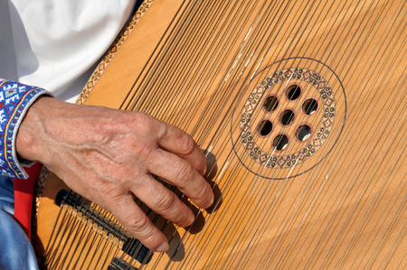 Unrecognizable  ukrainian ethnic musician playing bandura