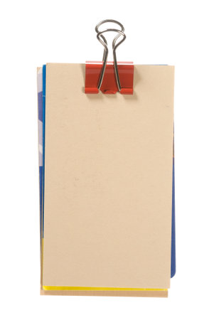 A bundle of paper with a clip isolated on whiteの写真素材