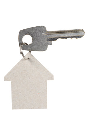 A house tag and a key on whiteの写真素材