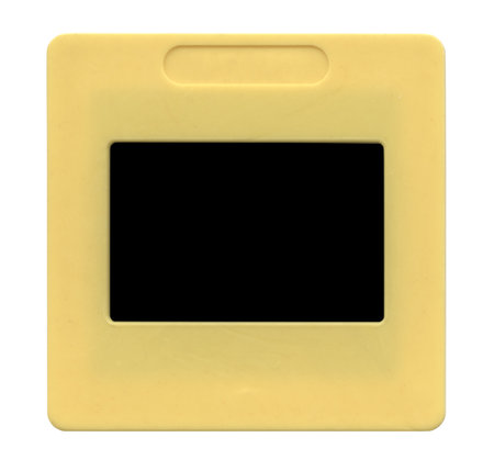 Old plastic slide film mount frame on whiteの写真素材