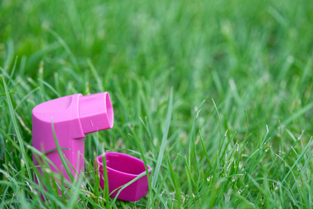 Asthma inhaler on a green grass meadow. selective focus. copy spaceの写真素材