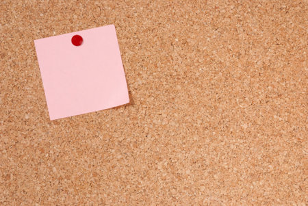A piece of note-paper tacked to cork