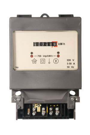 An old analogue active energy meter on white