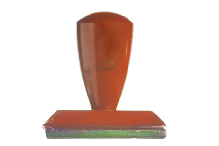 An old rubber stamp, on white.の写真素材