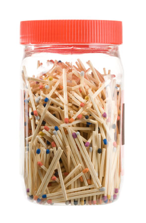Matches in a jar on whiteの写真素材