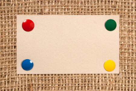 A piece of paper tacked to a sacking canvasの写真素材