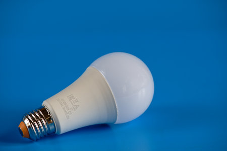 Energy-saving LED light bulb on a blue background