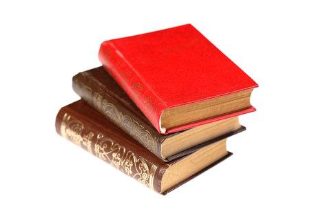A stack of old books isolated on white background. Selective focusの写真素材