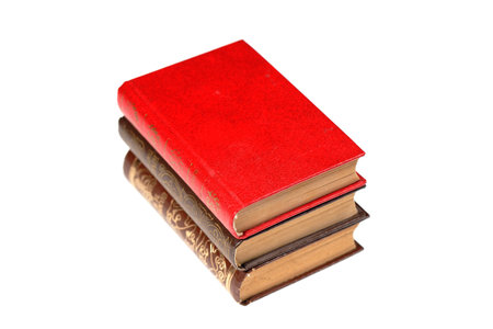 A stack of old books isolated on white background. Selective focusの写真素材