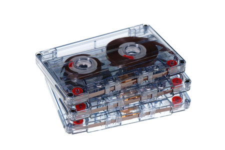 Stack of retro audio cassettes isolated on white background, 80's music concept. Selective focusの写真素材