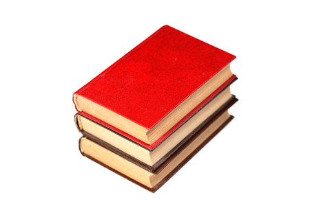 A stack of old books isolated on white background. Selective focusの写真素材
