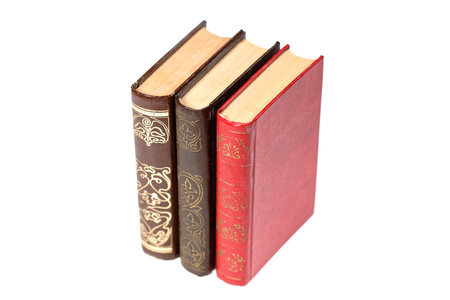 A stack of old books isolated on white background. Selective focusの写真素材