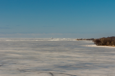 Russia. Saint-Petersburg. Kronshtadt. Tolbukhin lighthouse in the Gulf of Finland and Fort Reef. Ice hummocks.の写真素材