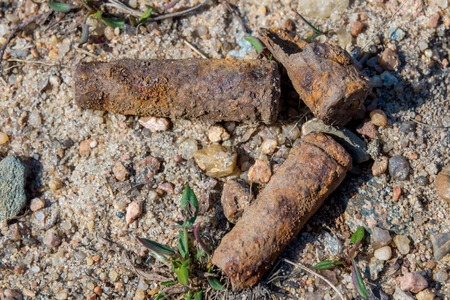 Russia. Saint-Petersburg. Old rusty submachine gun shells in the sand on the territory of the former shooting range in Kronstadt.の写真素材
