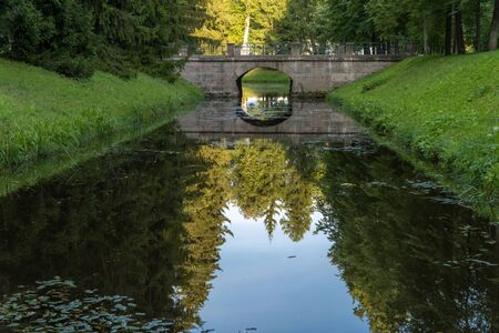 Stone historical bridge over the canal in Oranienbaum Lomonosov Park.の写真素材