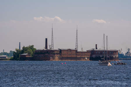 Russia June 6, 2021. Yachts and boats during the sailing regatta at the Kronstadt Sail Festival take place against the backdrop of the Emperor Peter I Fort, located near the fairway on the southern coast of Kronstadt.のeditorial素材