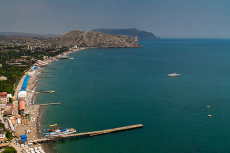 The Republic of Crimea. July 12, 2021. Summer picturesque view of the city of Sudak from the height of the Genoese fortress, located on the Serf mountain.のeditorial素材